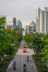 Perspective of road with finacial tower in background in Bangkok capital city of Thailand