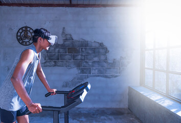 Full length profile shot of a young man running on a treadmill and wearing a vr headset at home.