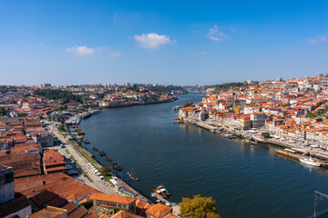 View of the banks of the Douro river in the city of Porto and Vila Nova de Gaia. A hill descending...