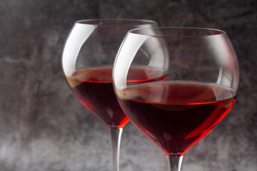 two glasses with red wine cpuan plan.