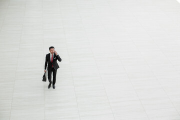 top view from afar.Businessman talking on a mobile phone