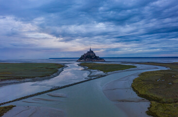 Le Mont Saint Michel, France Castle in Ocean at Sunrise or Sunset, Mystical Horror look of spooky castle in Sea