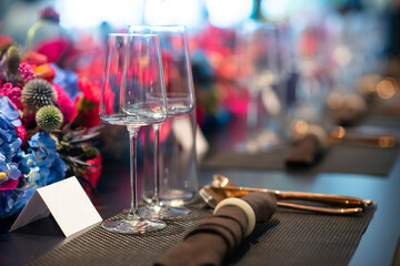 empty wine glasses set up on vibrant flower decor table