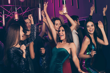 Photo of young students company celebrating together prom in the night club chilling dancing...