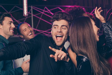 Photo of happy cheerful boy dancing at party dance floor together joking pointing with finger...