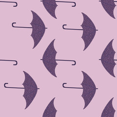 Simple seamless doodle season pattern with umbrella silhouettes. Rainy protection accessory print in purple and lilac tones.