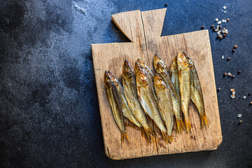 sardines sprats smoked or salted fish seafood meal on the table tasty serving size portion top view...