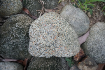 plutonic granite rock on nature background. Granite, coarse- or medium-grained intrusive igneous...