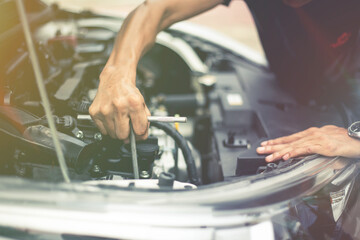 Close-up Hands of car mechanic in auto repair service.Automobile Repair Service Fix car Concept.
