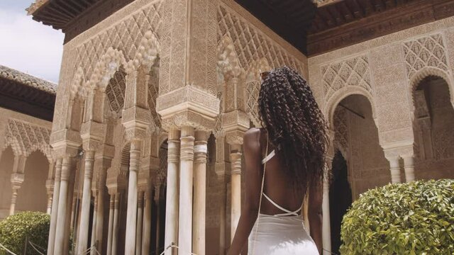 Tourist In White Filming The Alhambra With Phone