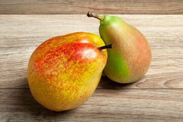 Pears. Fresh ripe organic pears on a wooden background. Vegetarian, vegan healthy food. Diet organic product. Selective soft focus.