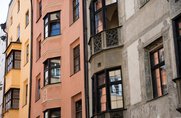 Fototapeta na wymiar Colorful residential facade with windows in Innsbruck