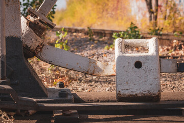 Arrow for switching tracks of railway lines. Close-up counterweight. The fall of the year.