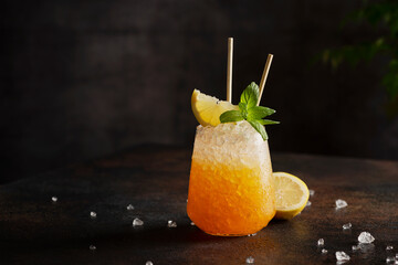 cocktail with crushed ice, lemon and mint