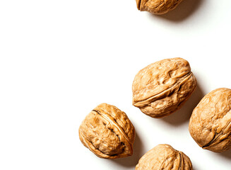 Walnuts on a white background top view. Free space for text. Soft focus. Stylish food background with nuts.