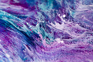 Resin art texture with blue, lilac and white colors. Fluid background with splashes and ripples. Abstract frozen texture with splatter inks. Vibrant pigments mixes on macrophotography picture