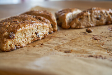 Traditional fresh baked English homemade scones with raisins for breakfast. 