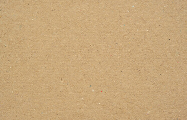 Texture of brown craft or kraft paper background, cardboard sheet, recycle paper, copy space for text.