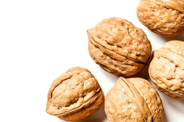 Walnuts on a white background top view. Free space for text. Soft focus. Stylish food background with nuts.
