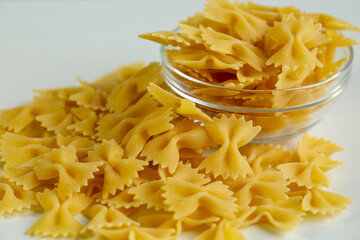 Italian pasta in the shape of a butterfly in a bowl.