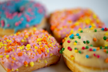 Colored donuts, on a white background.