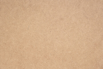Texture of brown craft or kraft paper background, cardboard sheet, recycle paper, copy space for text.
