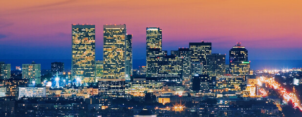 Los Angeles skyline at dusk. View of Century City and Pacific Ocean.