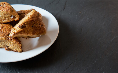 Traditional fresh baked English homemade scones with raisins for breakfast.   