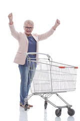 in full growth. a very happy old woman with a shopping cart