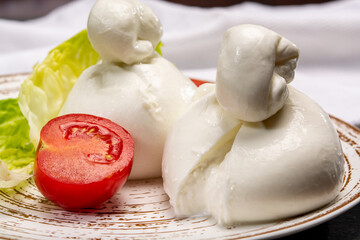 Cheese collection, italian soft white balls of burrata cheese made from mozzarella with cream...