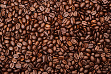 Top view of brown roasted coffee beans, can be use as background, copy space for text.
