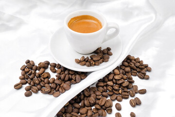 Espresso coffee and coffee beans on a white background