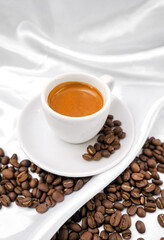 Espresso coffee and coffee beans on a white background