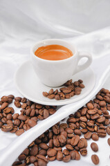 Fototapeta premium Espresso coffee and coffee beans on a white background