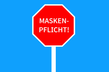 Maskenpflicht auf Stoppschild