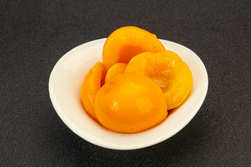 Marinated peaches fruit in the bowl