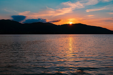 Beautiful alpine sunset view with reflections at the famous Tegernsee, Bavaria, Germany