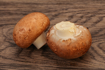Raw Brown Champignons over background