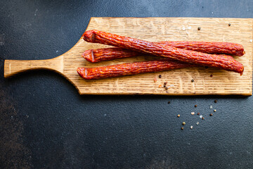 smoked sausages dry-cured meat meal on the table tasty serving size portion top view copy space for...