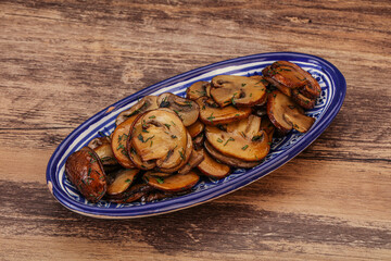 Roasted champignon with herbs and spices