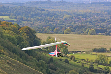 Fototapeta na wymiar Hang Glider flying at Westbury, Wiltshire