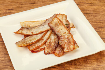 Roasted juicy bacon in the plate