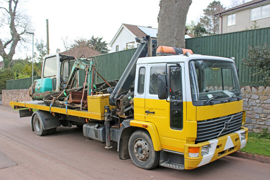 Recovery Truck transporting a digger