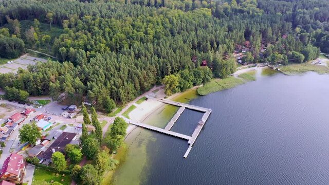 4K high angle video of pier in Narie lake in Kretowiny village, Ilawa Lake District, Warmia Mazury region of Poland