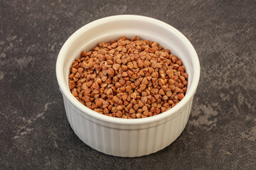 Raw buсkwheat cereal in the bowl