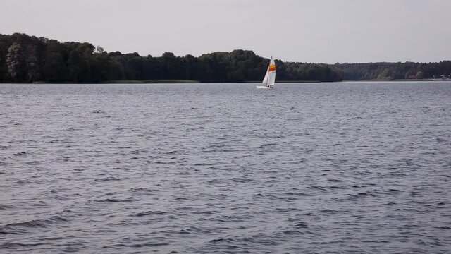 Sailing boat on Narie lake in Kretowiny village in Ilawa Lake District, Warmia Mazury region of Poland