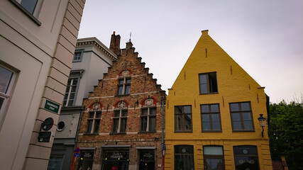 Bruges, Belgium - May 12, 2018:  Roofs And Windows Of Old Authentic Brick Houses On Street Sint-Jakobsstraat