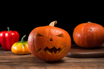 A jack-o '-lantern for Halloween is set against a black background