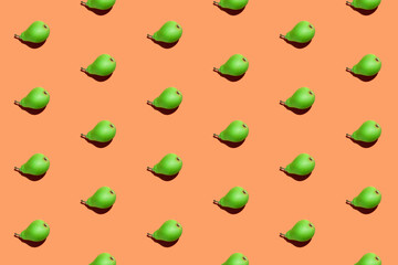 Juicy pears seamless pattern. Colorful seamless pattern of fresh pears on an orange background. Fresh ripe organic pears isolated on orange surface. Vegan, vegetarian healthy food.