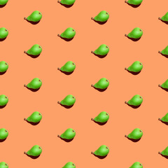 Juicy green pears seamless pattern. Colorful seamless pattern of fresh pears on an orange background. Fresh ripe organic pears isolated on orange surface. Vegetarian healthy food.